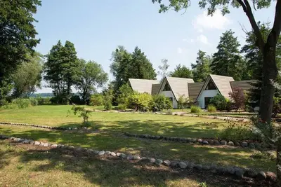 Image de FinnhĂĽtte Lac Schwerin - Maison 2 - A Lake House - chalets sur le lac de Schwerin