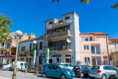 Image de Appartement de vacances avec climatisation, WiFi et balcon avec vue sur la mer