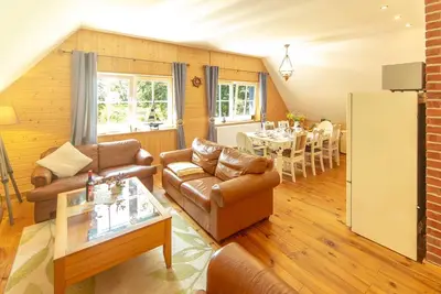 Image de Appartement Og - Appartements dans la maison au toit de chaume