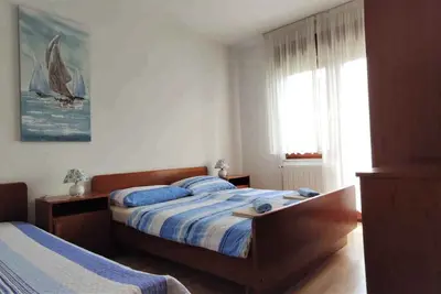 Image de Appartement de vacances avec balcon, barbecue, jardin et Wi-Fi