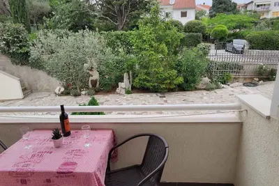 Image de Appartement de vacances avec balcon, barbecue, jardin et Wi-Fi.