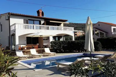 Image de Appartement de vacances avec utilisation de piscine et balcon