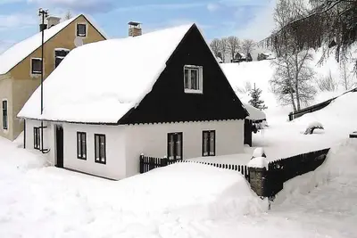 Image de Maison de vacances avec cheminée dans le domaine skiable