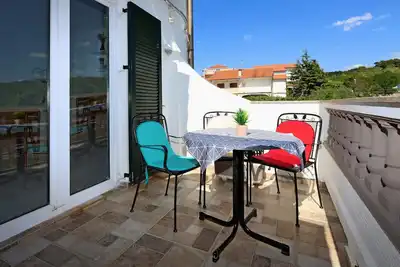 Appartement d'une chambre avec la terrasse et la vue sur le mer Barbat, Rab (A-14247-c)