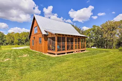 Image de Cabine Greenfield avec véranda et foyer aménagés