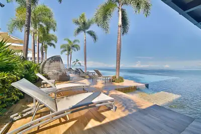 Image de Magnifique Condo de luxe face à la mer (bar sur la plage et sur le toit et piscines à débordement)