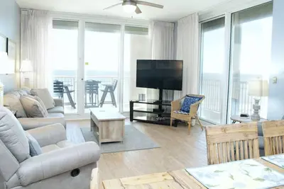Image de Unité de coin A1110 Kng / Qn / 2 fulls / Sofa Sleeper Direct Gulf View-Wifi - 10 personnes!