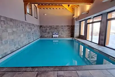 Image de Magnifique appartement/duplex 4*, au style savoyard dans un cadre grandiose