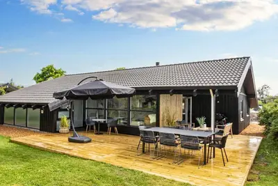 Image de Maison de vacances pour 8 a Bindslev-By Traum