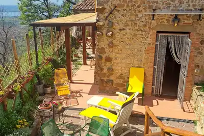 Image de Cozy stone house, flowered garden, beautiful view, free WiFi, air cond. 12km sea
