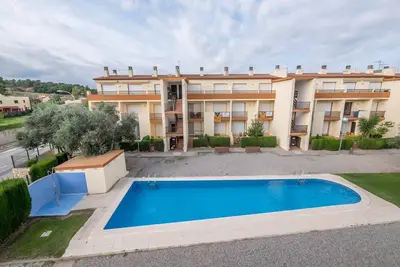 Penthouse à l'Escala avec piscine commune.
