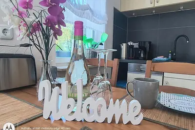Image de 4 * Fh avec jardin, aire de jeux, sauna, fitness, 2 chambres, cuisine avec lave-vaisselle