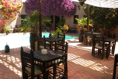 Image de Riad  de charme tout confort avec piscine sans vis à vis et grand jardin arboré.