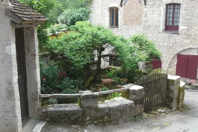 Image de Gîte de Charme à Saint Cirq Lapopie avec une chambre climatisée