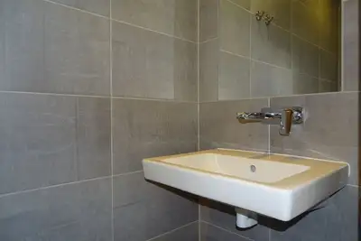 Image de Boszicht 3 sur la côte appartement spacieux pour 4 adultes. et 1 enfant. Plage 800 mètres