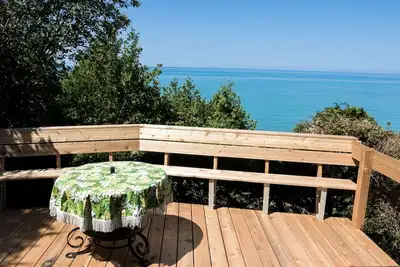 Waterfront cottage close to Bayfield, with private beach, barrel bunkie, firepit