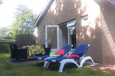Image de Boszicht 6 sur la côte appartement spacieux pour 2 adultes. et 2 enfants. Plage 800 mètres