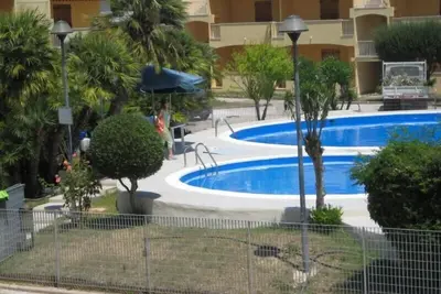 Image de Alghero Lido face à la plage à la maison avec piscine