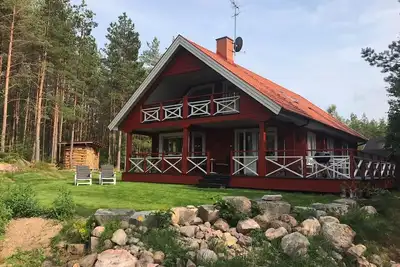 Image de Vacances de rêve au bord du lac avec sauna, feu ouvert, bateau, WiFi, 3 chambres, abri voiture