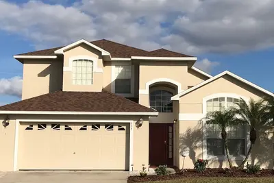 Image de 5 Br, 4 Ba, Villa de 2 étages, à 10 minutes de Disney, Lakefront, pêche, piscine chauffée, WiFi