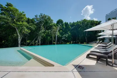 Image de New-Tao Riviera Resort Condo avec accès à la plage et au golf