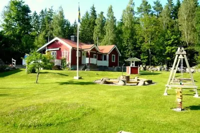 Image de Sauna, bateau, espace barbecue, très adapté aux enfants, balançoire, bac à sable, canoë, WiFi