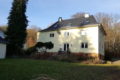 Image de Appartement près de la forêt avec un grand jardin avec aire de jeux et d'un foyer