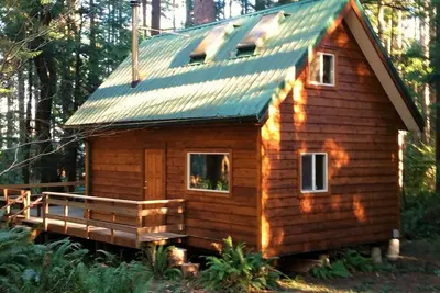 Image de Jolie cabane en rondins confortable nichée dans une zone boisée privée entre 2 plages de sable