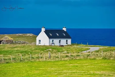 Image de Chalet confortable des Hébrides surplombant l'Atlantique sur la côte ouest de North Uist