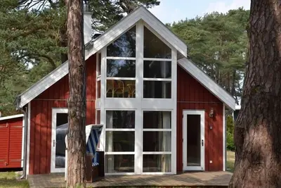 Image de Maison de plage « Mer Baltique » avec vue sur la mer, jacuzzi, sauna et. Cheminée, chaise de plage