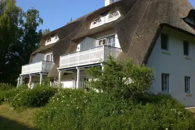 Image de Appartement près de la plage dans la maison au toit de chaume