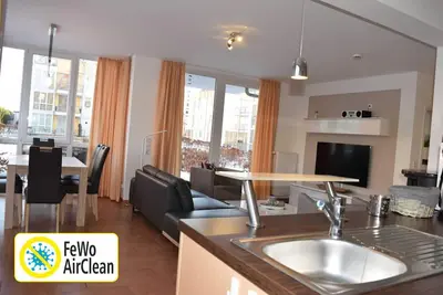 Image de Appartement près de la plage avec sauna, jacuzzi et cheminée, d'une connexion Wi-Fi