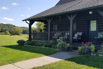 Image de Grande maison de bois rond avec beaucoup de place pour se détendre, pour 13 personnes