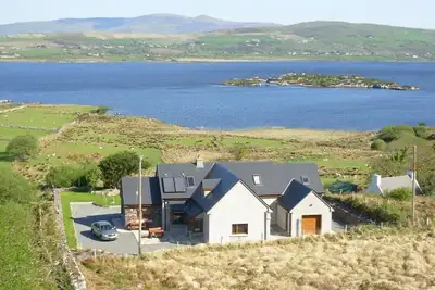 Image de Maison de vacances 5 * avec vue sur Lough Currane. Wifi gratuit près de Hogs Head Golf Course