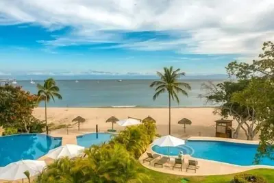Image de Condo 5 étoiles face à la plage - Membre Premier / Superbe cuisinier / gouvernante / voiturette de golf