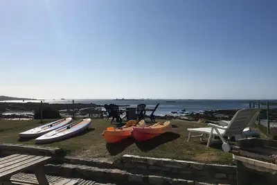 Image de Villa Wifi Kayaks Stand up piano chiens ok \" les pieds dans l'eau \" à Portsall