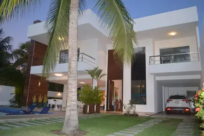 Image de Excellent accueil - 05 suites avec air conditionné, piscine et barbecue