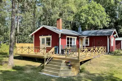 Image de Lillarmsjö-cottage, chalet avec vue sur le lac.