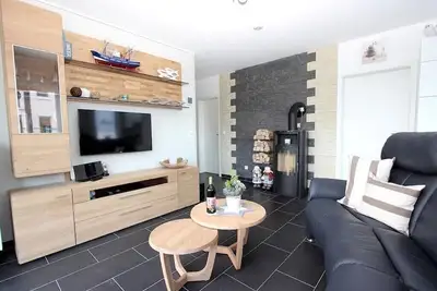 Image de 100 m de la plage Sauna | Cheminée | Jacuzzi | Wlan | Blanchisserie | chaise de plage