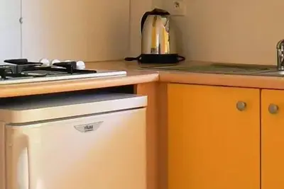 Image de Mobilheim mit 3 Zimmern für 4 Personen (3 Erwachsene und 1 Baby) + Tv
