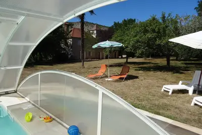 Image de A 200m de la Dordogne, maison en pierre rénovée, avec Spa & piscine, parc 1 ha