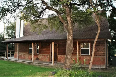Image de Cabine confortable avec cheminée et vue sur le lac Travis