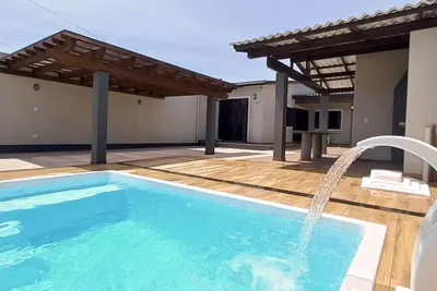 Image de Maison individuelle sur le patio avec deux chambres et une connexion Wi-Fi à Capão Da Canoa
