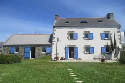 Image de la maison aux mouettes et aux volets bleus