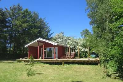Image de Cabane en bois clair sur la meilleure plage de Zélande.