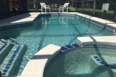 Image de À seulement six kilomètres de Disney! 4 lits, 3 bains, piscine privée et spa