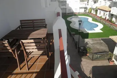 Image de appartement avec une piscine extérieure, un parking, Wifi