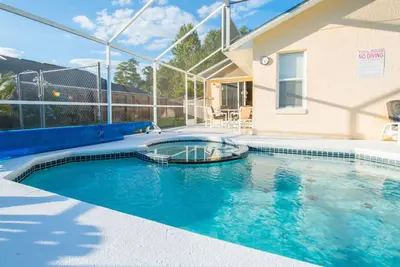 Image de Floride Villa Lake Side View avec 36 pieds plein sud piscine et spa