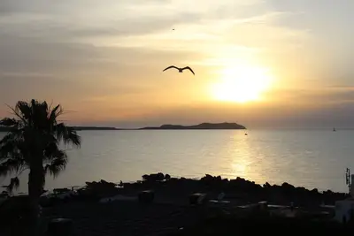 Image de Appartements Ses Fontanelles avec vue frontale sur la mer et le coucher du soleil