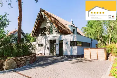 Image de Maison de plage 5 ***** étoiles (nouveau à partir de 2017), bain à remous extérieur, sauna, WiFi, bien-être